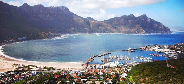 Hout Bay Harbour w/ market circled, Chapmans Peak behind