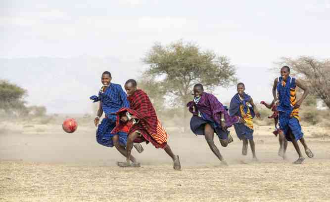 Maasai people playing soccer