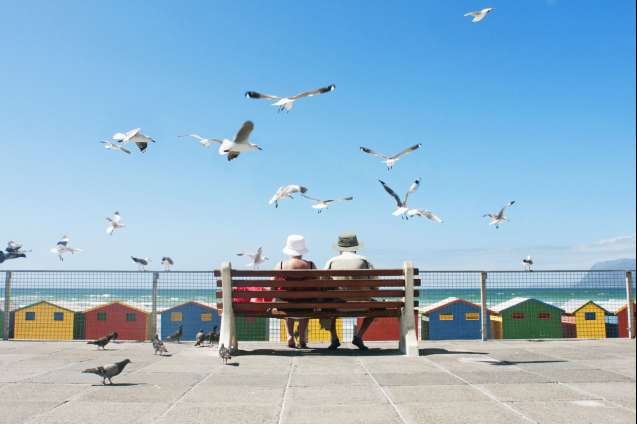 Senior couple enjoying a relaxing holiday with ocean views in Cape Town, South Africa