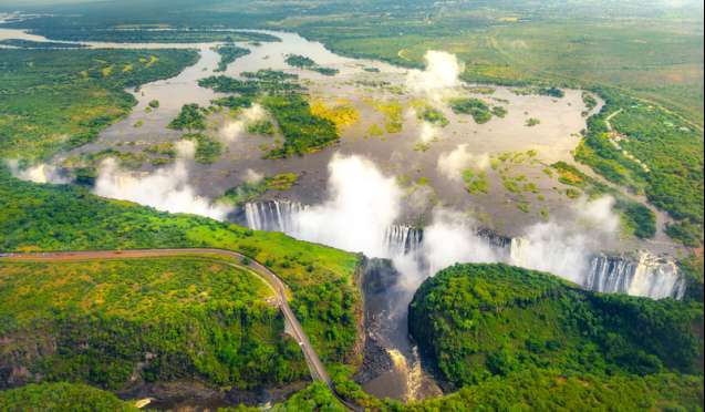 A flight over the Victoria Falls in full flow between Zimbabwe and Zambia