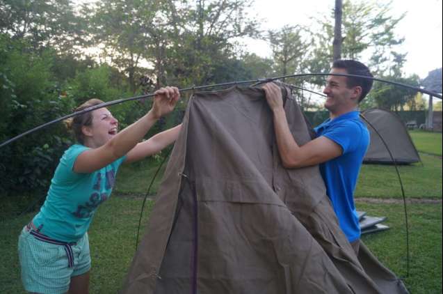 Having fun pitching a tent