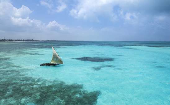 Zanzibar dhow boat in turquoise waters